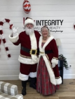 Big Red Santa & Mrs. Claus at Keller Williams Realty